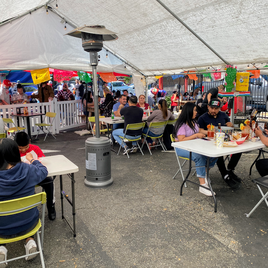 A full patio of guests at Mariscos Costa Alegre
